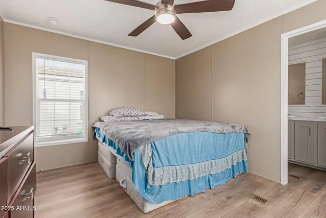 a bedroom with a bed and a window