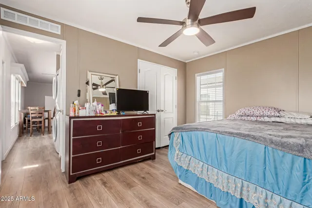 a bedroom with a bed and a television