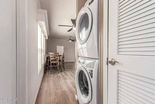 a view of a hallway with washer and dryer