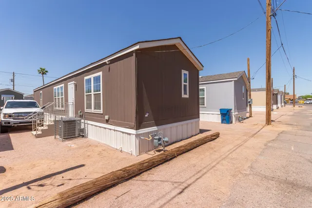 a front view of a house with barbeque outdoor seating