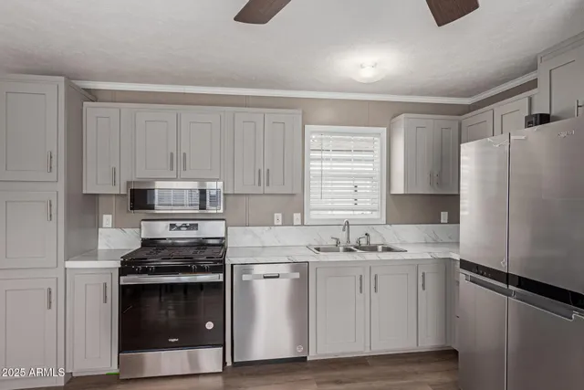 a kitchen with a sink stove and refrigerator