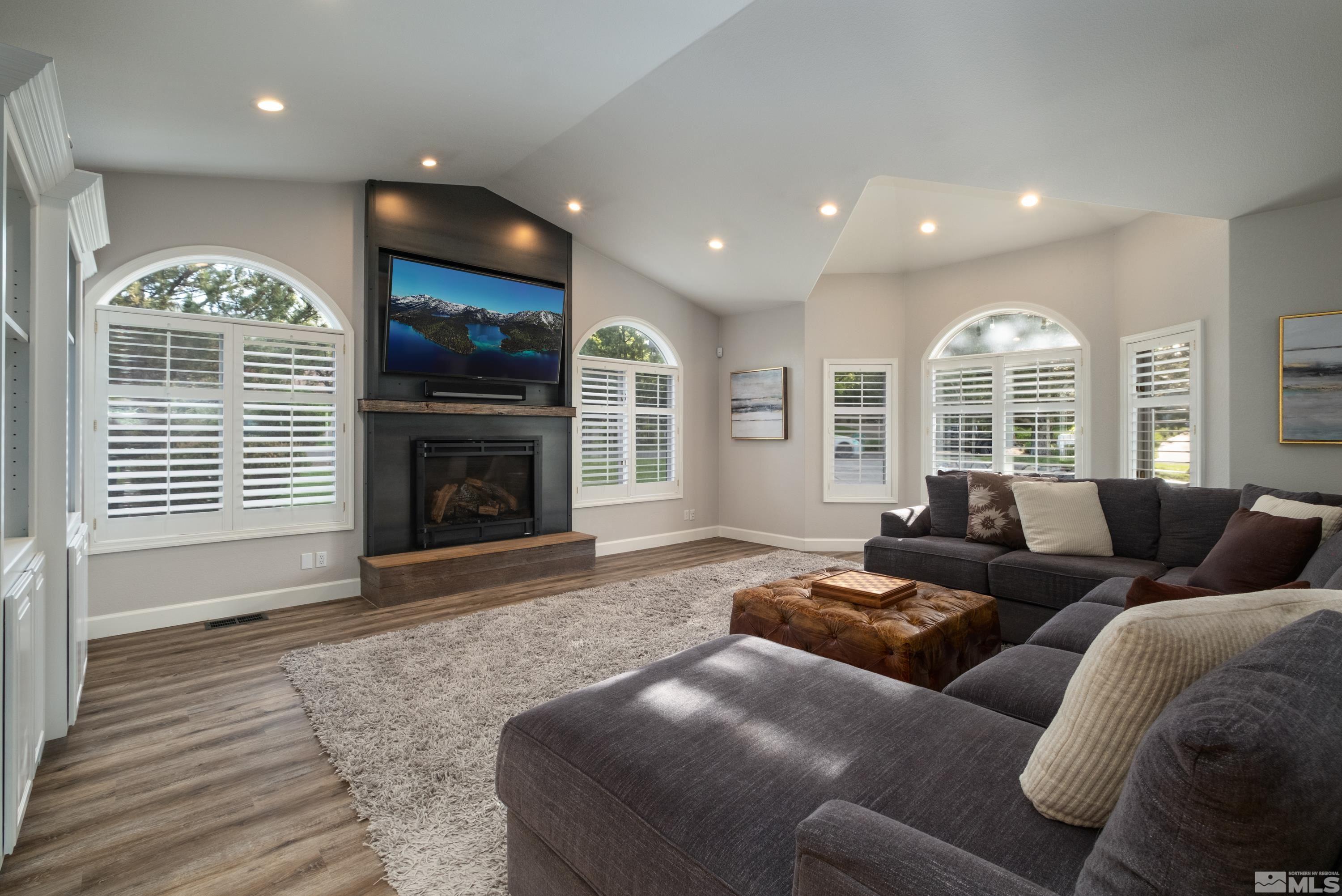 4300 Juniper Trail Reno, NV 89519 - Photo 20 of 39 a living room with furniture window and a fireplace