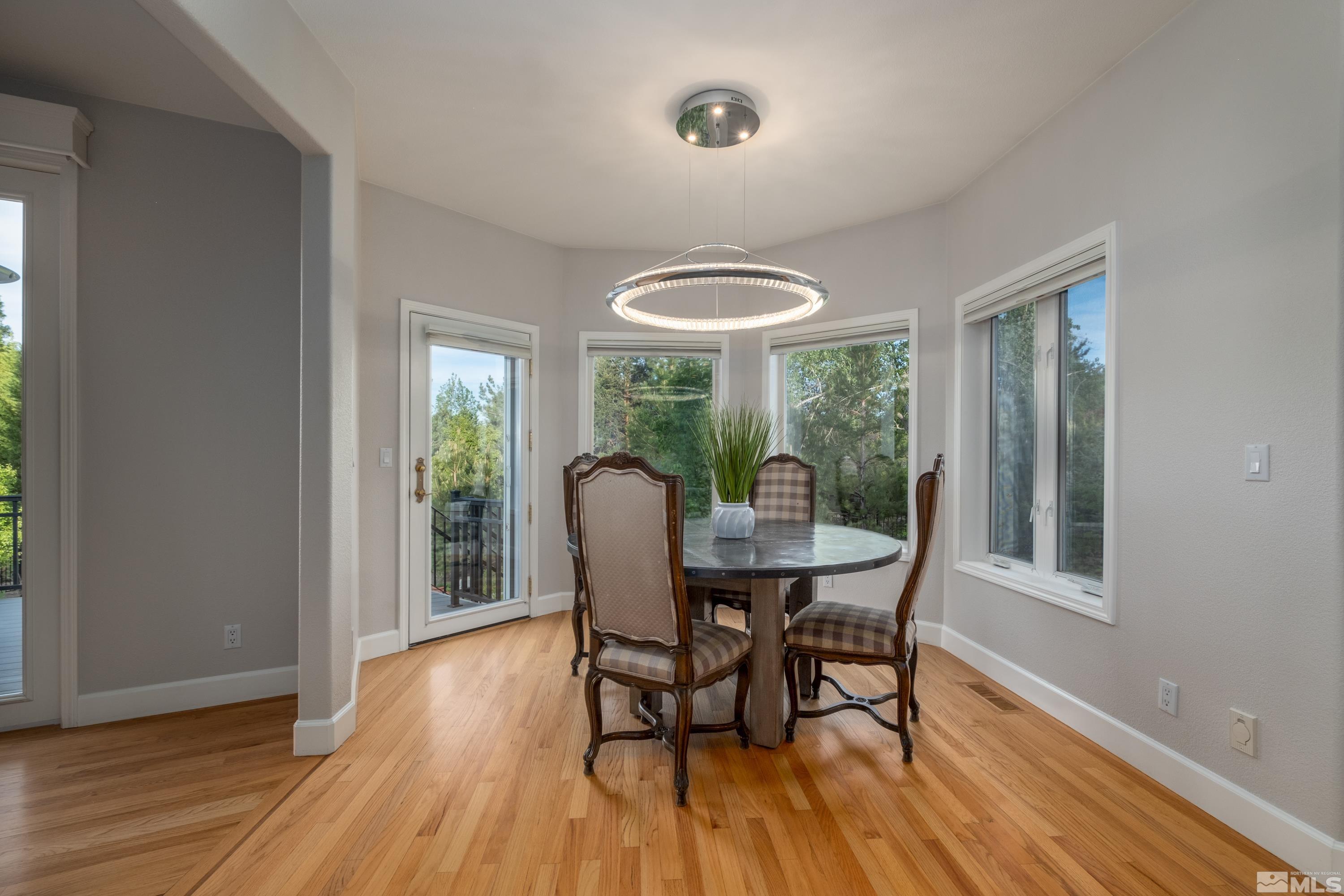 4300 Juniper Trail Reno, NV 89519 - Photo 24 of 39 a dining room with furniture window and wooden floor