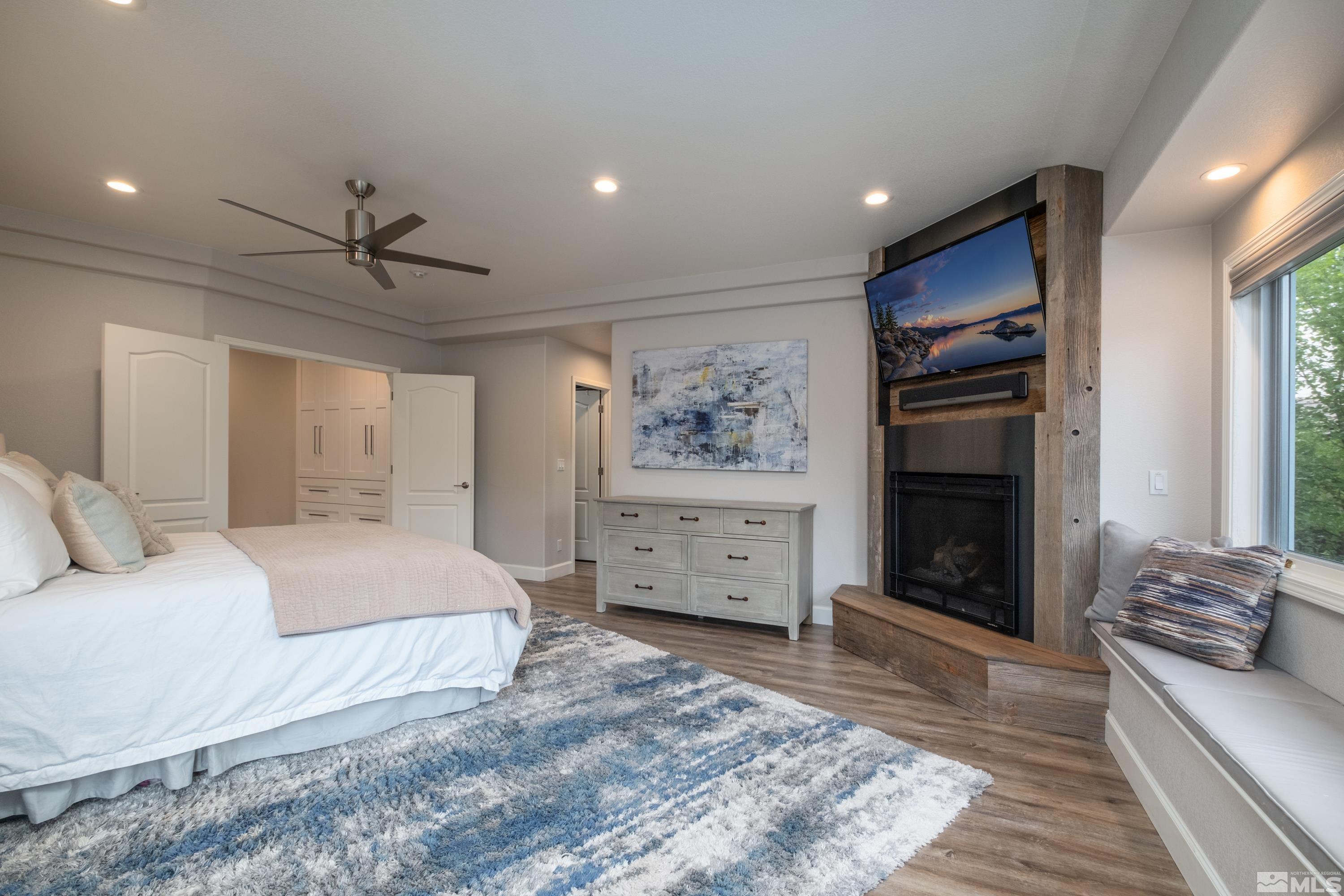 4300 Juniper Trail Reno, NV 89519 - Photo 28 of 39 a spacious bedroom with a bed and a couch