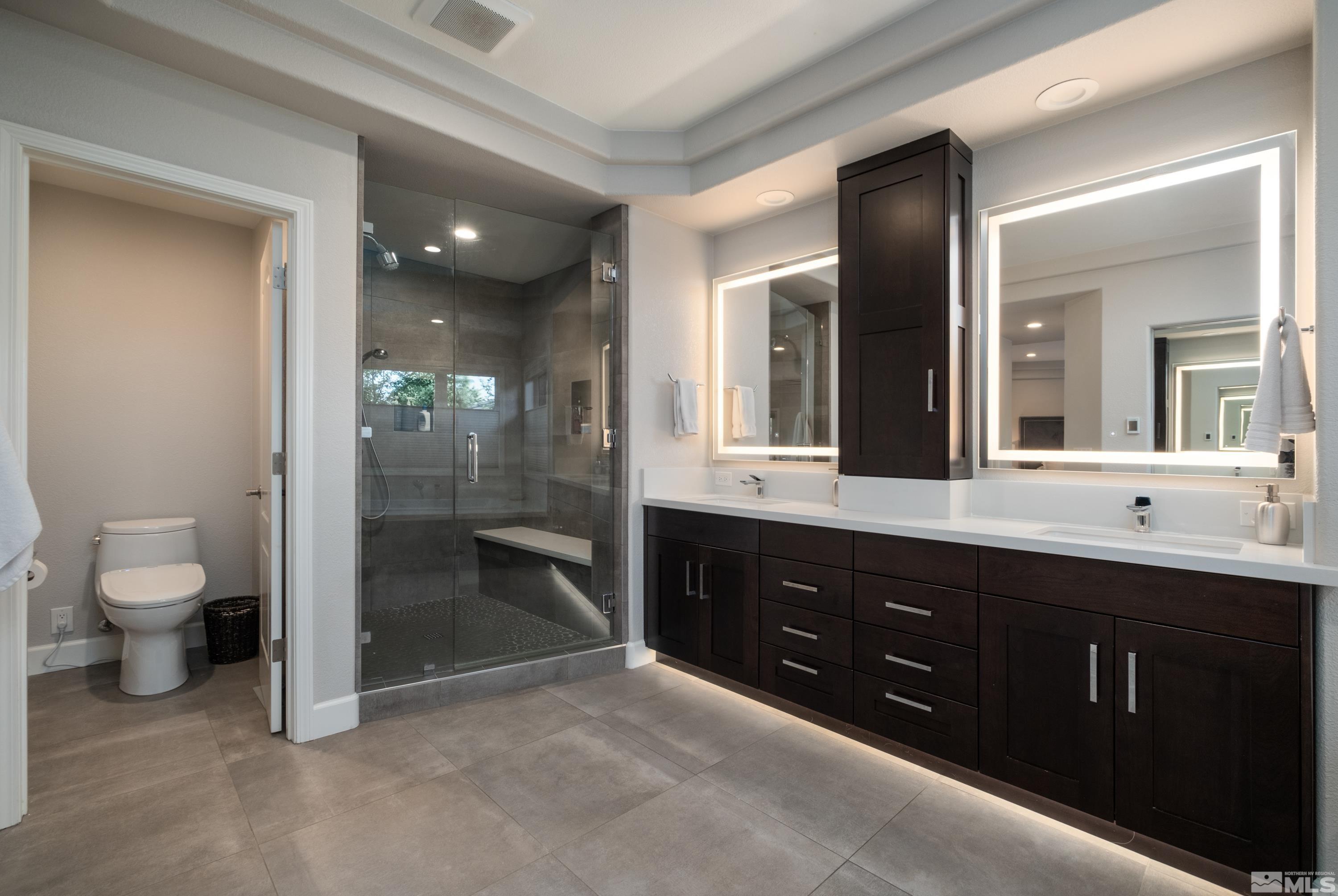 4300 Juniper Trail Reno, NV 89519 - Photo 30 of 39 a spacious bathroom with a double vanity sink toilet and shower