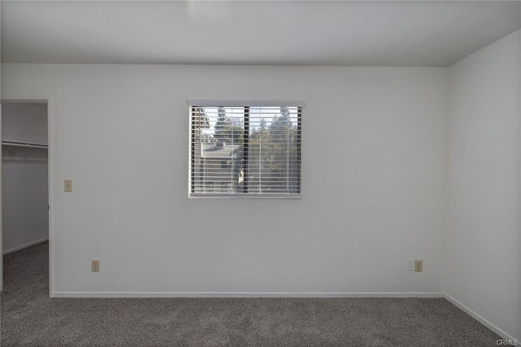 49400 River Park Road, Unit 17 Oakhurst, CA 93644 - Photo 27 of 34 an empty room with windows