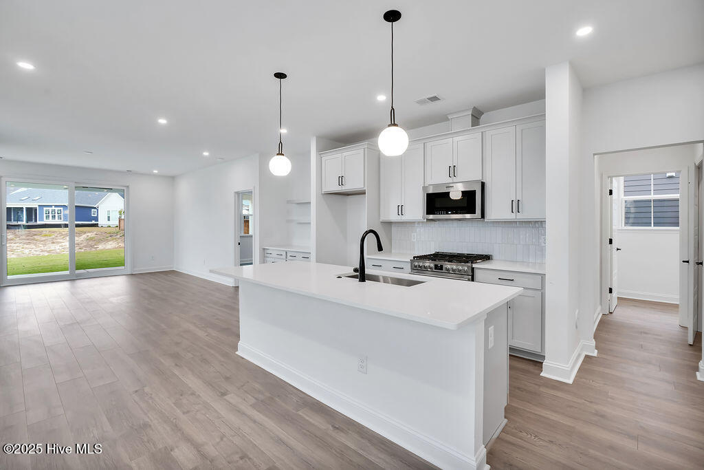 745 Caisson Run Wilmington, NC 28412 - Photo 16 of 43 Kitchen with Stainless Steel Appliances