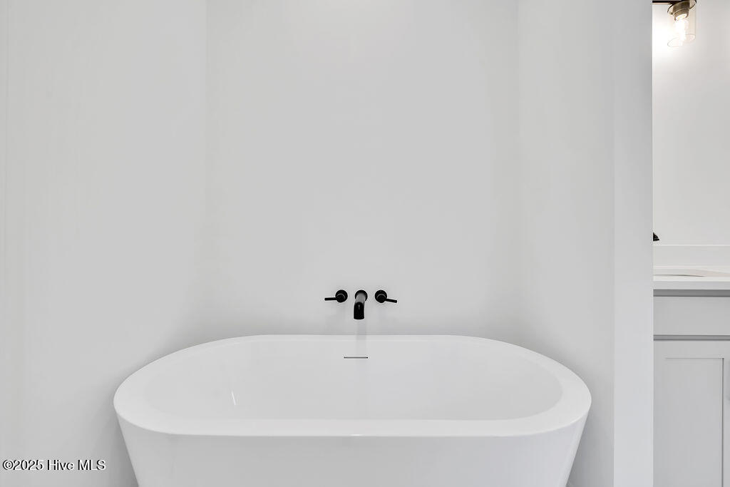 745 Caisson Run Wilmington, NC 28412 - Photo 21 of 43 Primary Bathroom with Freestanding Tub