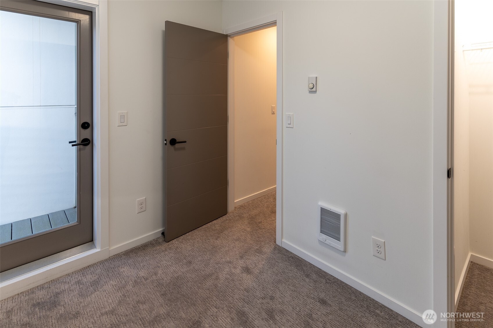 9030 18th Avenue Southwest, Unit B Seattle, WA 98106 - Photo 12 of 20 a view of a hallway to rooms