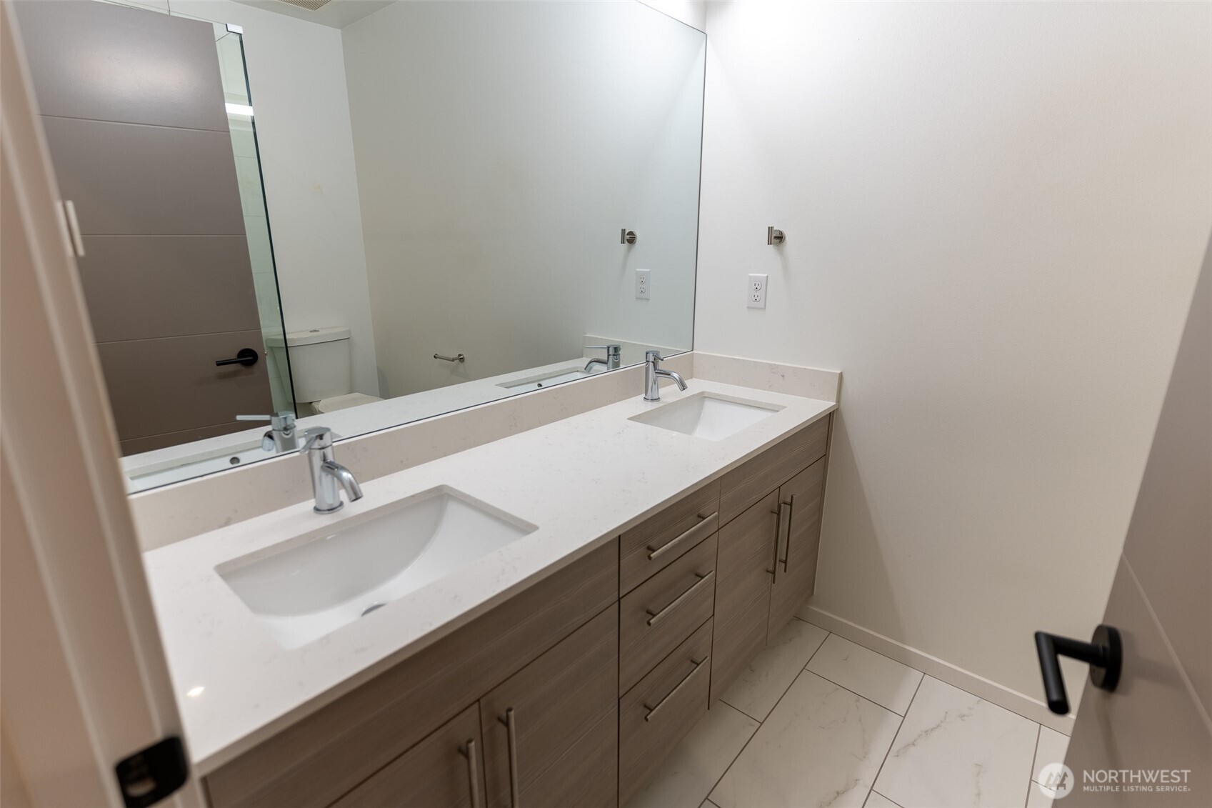 9030 18th Avenue Southwest, Unit B Seattle, WA 98106 - Photo 14 of 20 a bathroom with a sink and a mirror