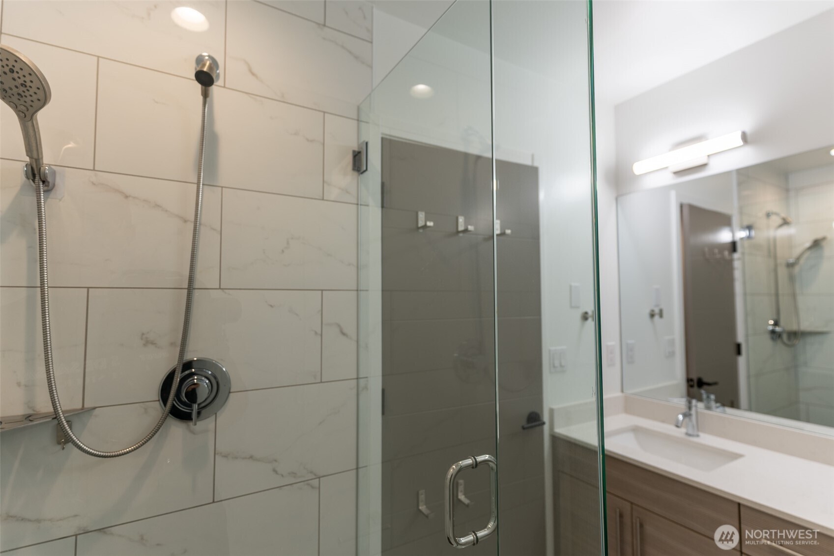 9030 18th Avenue Southwest, Unit B Seattle, WA 98106 - Photo 15 of 20 a bathroom with a shower and a sink