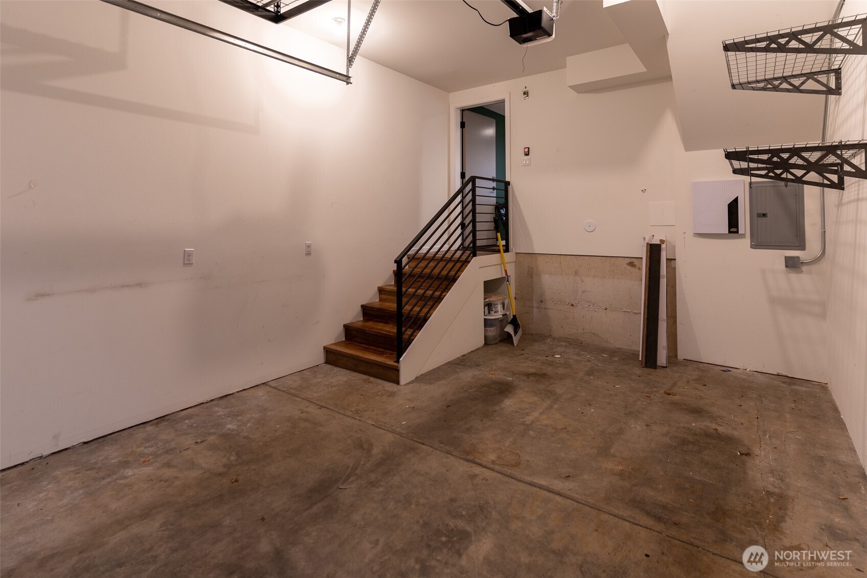 9030 18th Avenue Southwest, Unit B Seattle, WA 98106 - Photo 18 of 20 a view of a livingroom with wooden floor and stairs