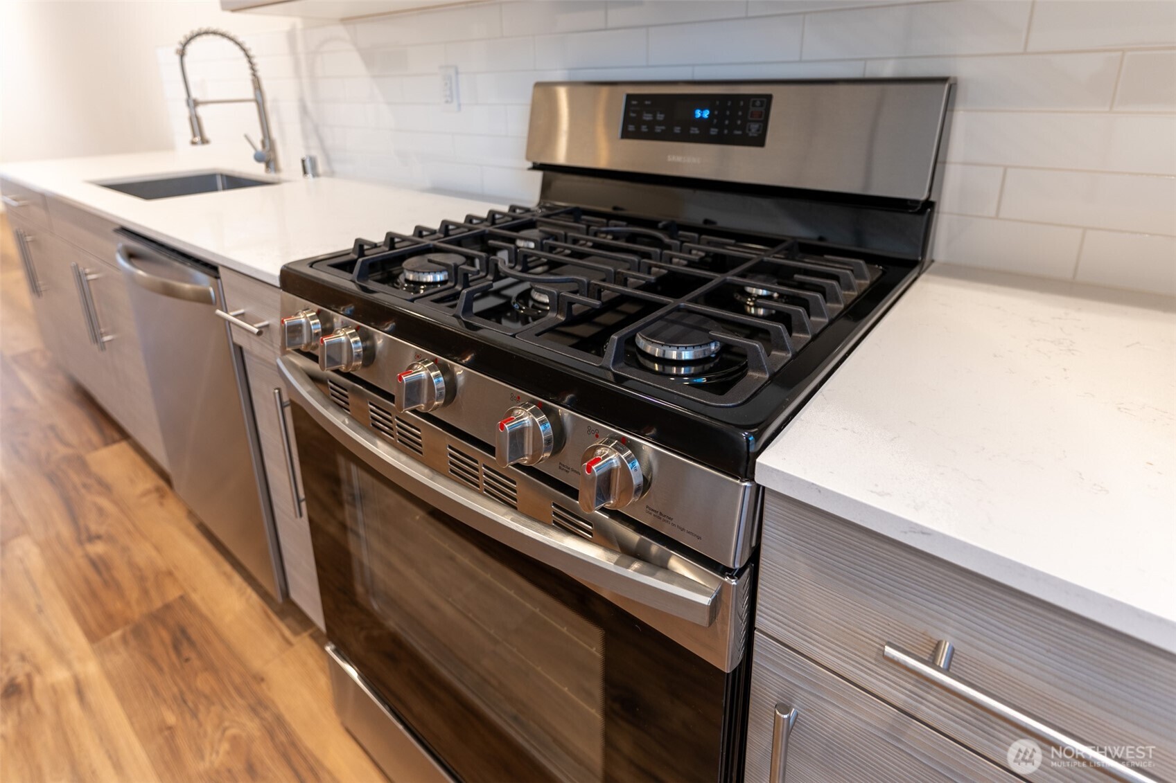 9030 18th Avenue Southwest, Unit B Seattle, WA 98106 - Photo 5 of 20 a stove top oven sitting inside of a kitchen