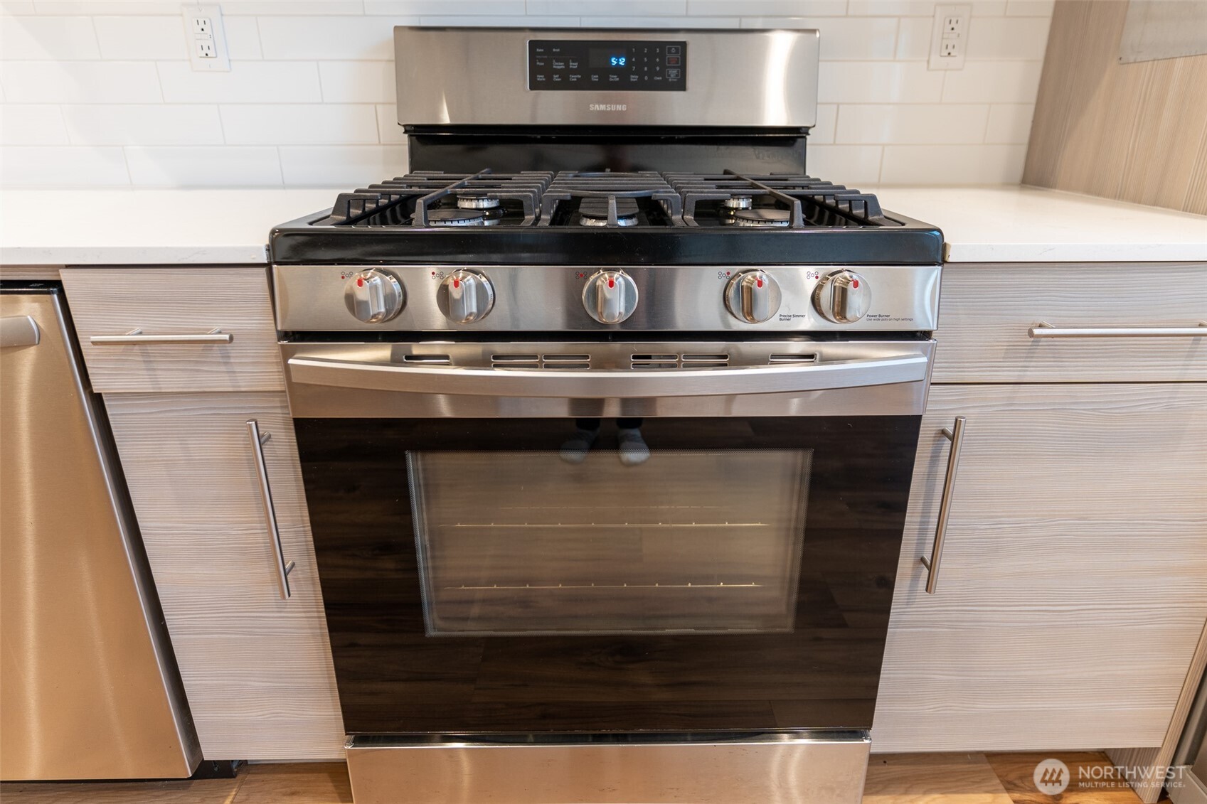 9030 18th Avenue Southwest, Unit B Seattle, WA 98106 - Photo 7 of 20 a stove top oven sitting inside of a kitchen