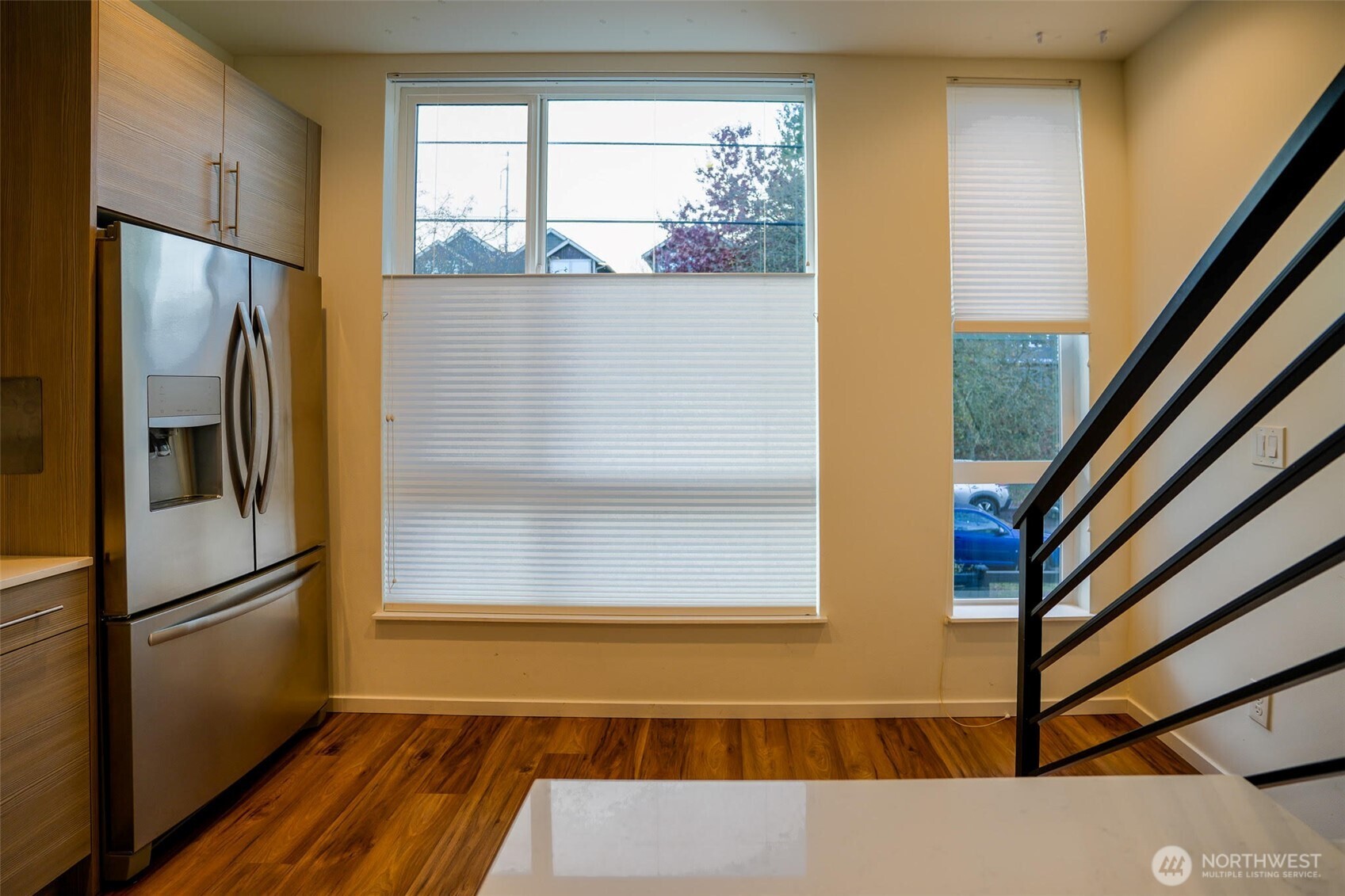 9030 18th Avenue Southwest, Unit B Seattle, WA 98106 - Photo 8 of 20 a view of a living room with wooden floor and a window