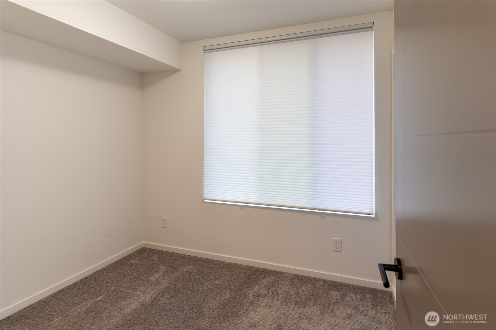 9030 18th Avenue Southwest, Unit B Seattle, WA 98106 - Photo 10 of 20 an empty room with a window