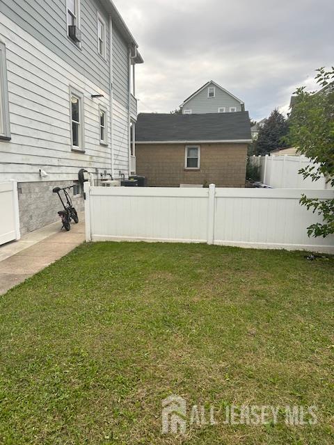 191 Fulton Street, Unit 2 Woodbridge, NJ 07095 - Photo 17 of 22 a front view of a house with a yard