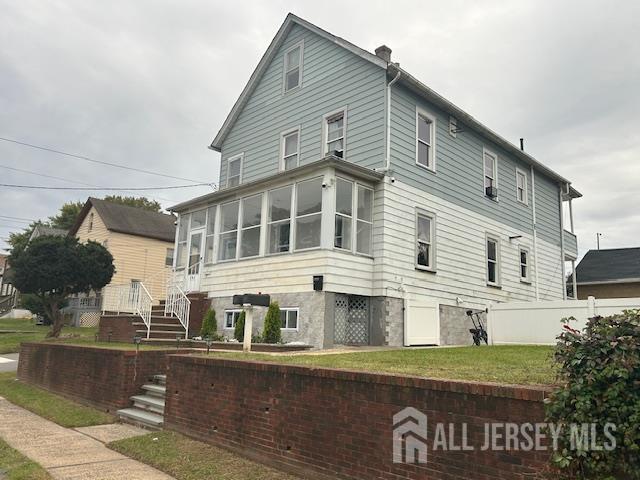 191 Fulton Street, Unit 2 Woodbridge, NJ 07095 - Photo 20 of 22 a front view of a house with a yard