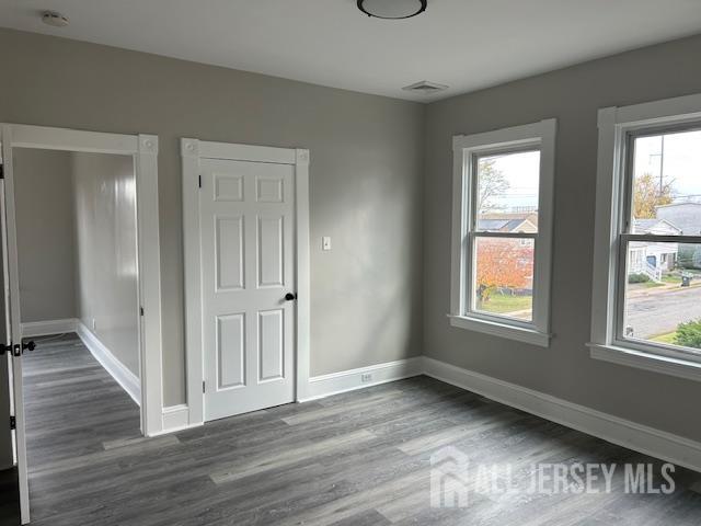 191 Fulton Street, Unit 2 Woodbridge, NJ 07095 - Photo 3 of 22 a view of a livingroom with wooden floor and a window