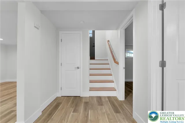 a view of wooden floor and windows in a room