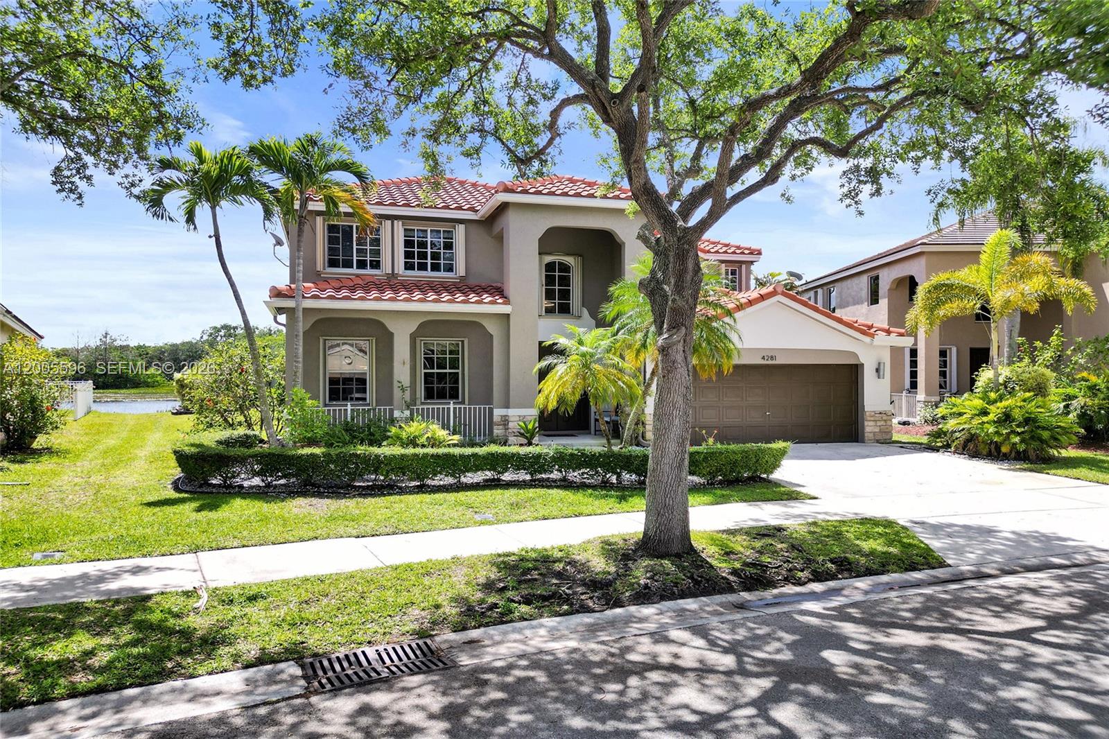 4281 Laurel Ridge Circle Weston, FL 33331 - Photo 6 of 80 a front view of a house with garden