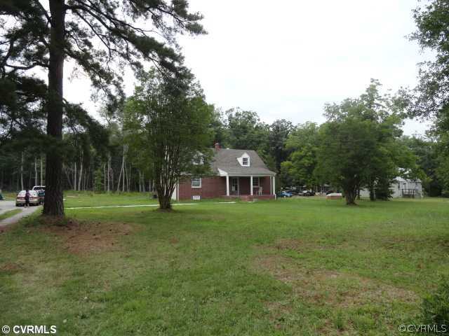 5930 Newbys Bridge Road Chesterfield, VA 23832 - Photo 9 of 11 a view of a house with a big yard and large trees