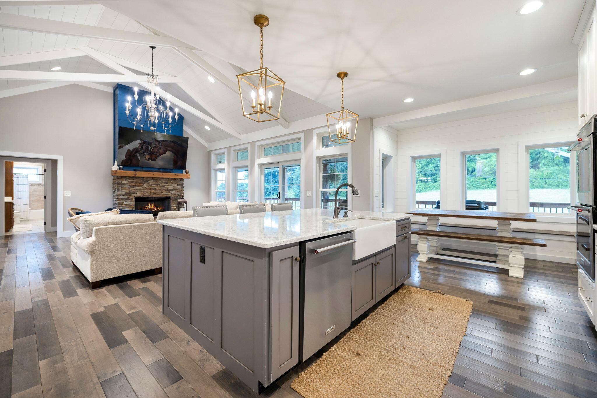 6866 Daus Mountain Road Whitwell, TN 37397 - Photo 5 of 49 a large kitchen with kitchen island a large counter space a sink stainless steel appliances and cabinets