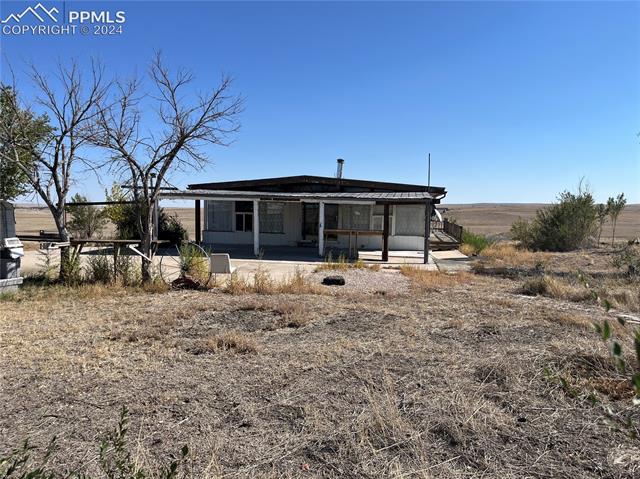 16785 North Yoder Road Calhan, CO 80808 - Photo 2 of 8 Rear view of house featuring a patio