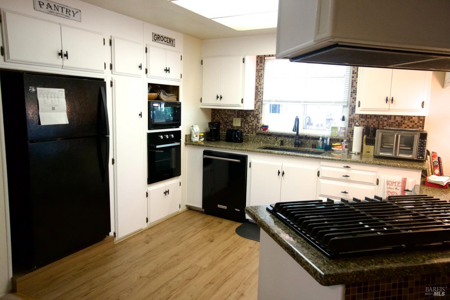 41 Plymouth Way Santa Rosa, CA 95403 - Photo 12 of 28 Nice large refrigerator, gas cooktop with hood