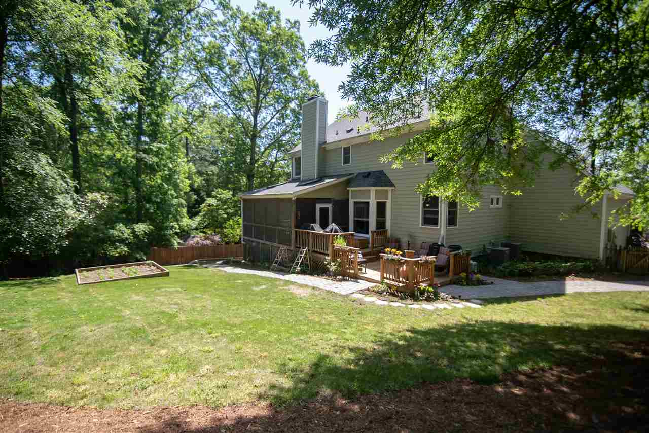 9720 Talman Court Raleigh, NC 27615 - Photo 28 of 30 Large, wooded lot featuring a lush garden full of veggies and herbs. Exterior Back