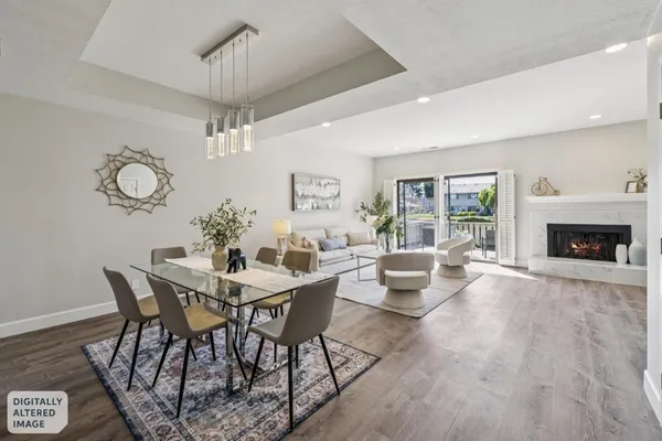 a view of a livingroom with furniture window and wooden floor