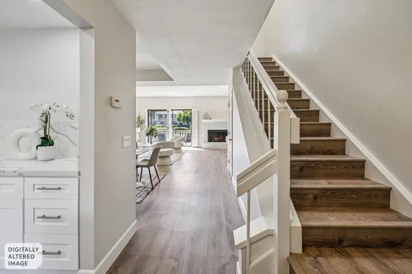 a kitchen with white cabinets stainless steel appliances and sink