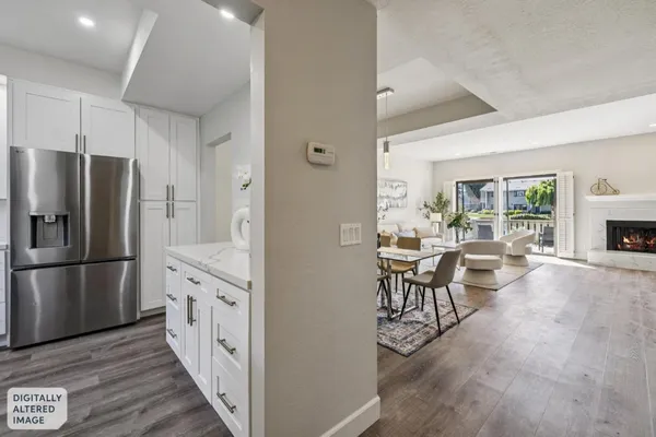 a kitchen with stainless steel appliances a stove microwave and cabinets
