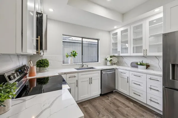 a dining room with furniture and wooden floor
