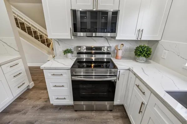 a dining room with furniture and chandelier