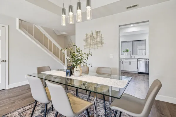 a living room with fireplace furniture and a large window