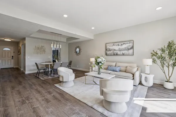 a view of a chairs and tables in the balcony