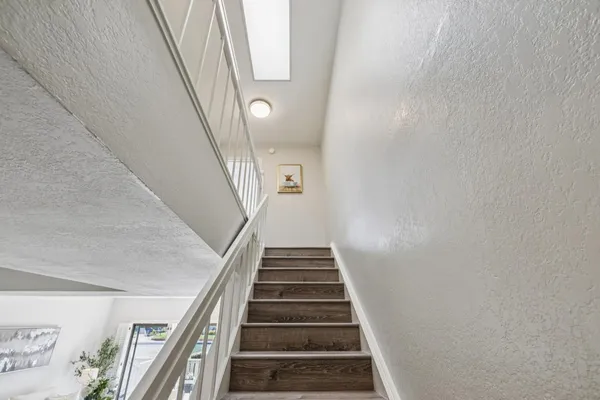 a bedroom with a bed and a lamp on table