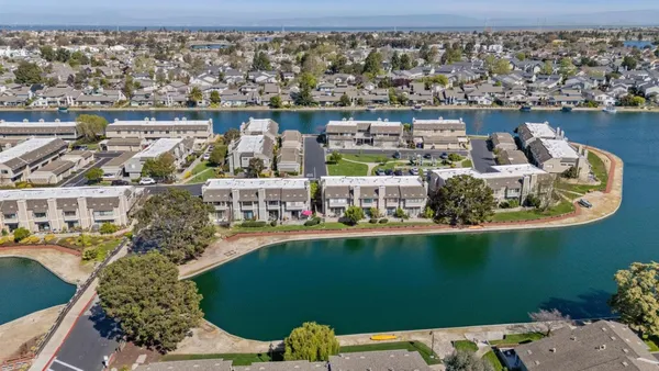 an aerial view of a house with a lake view
