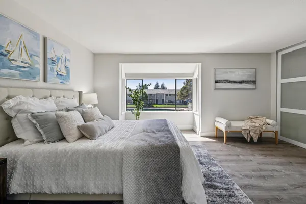 a bathroom with a granite countertop toilet and a shower