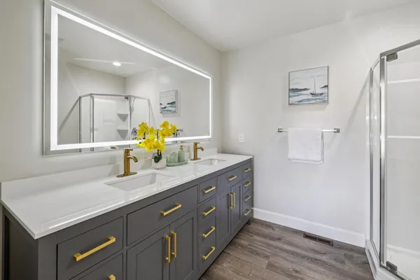 an aerial view of a house with outdoor space and lake view