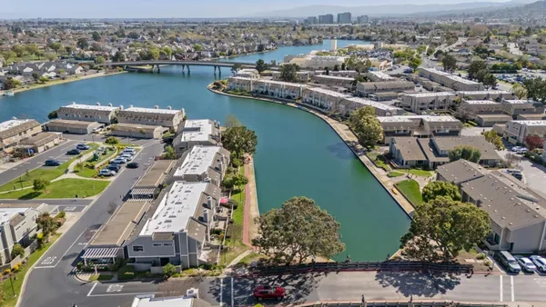 an aerial view of a residential houses with outdoor space