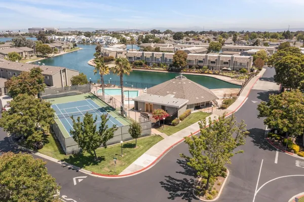 an aerial view of a house with a lot of trees