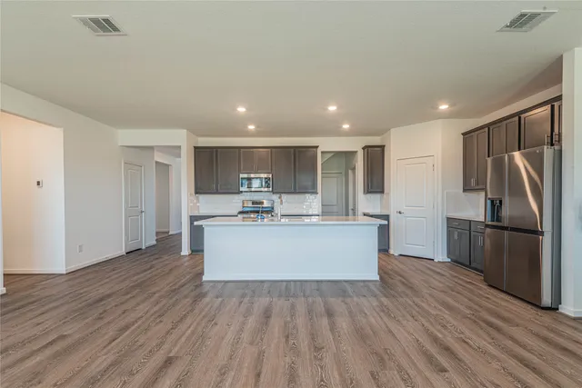 a view of kitchen with cabinets and stainless steel appliances