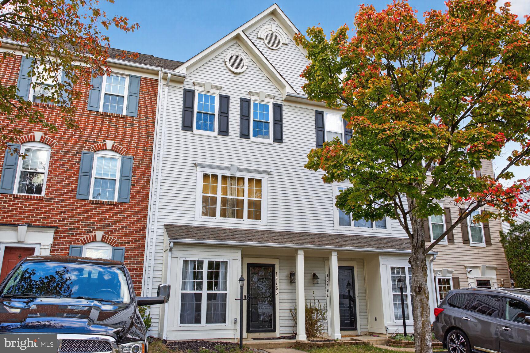 a front view of a house with parking space