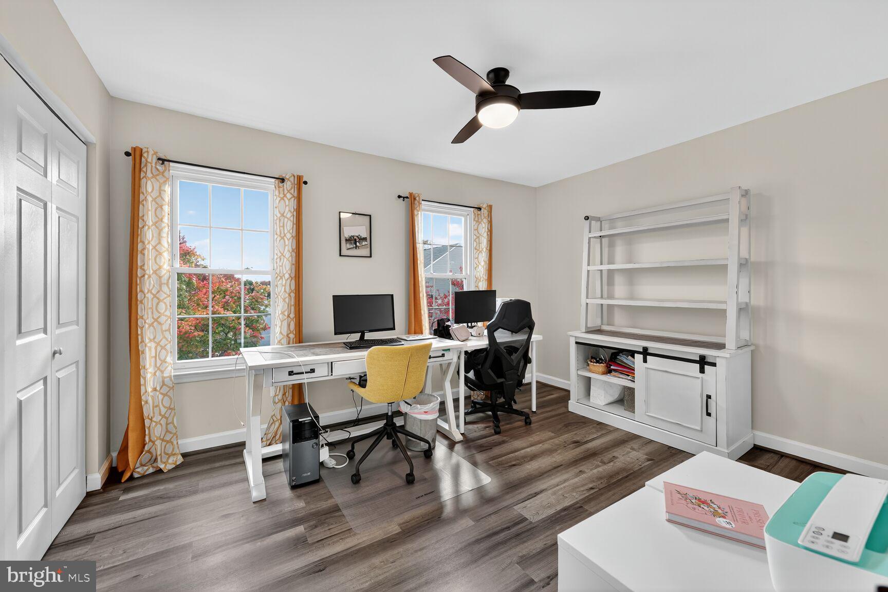 13486 Grouserun Lane Bristow, VA 20136 - Photo 16 of 20 a view of a workspace with furniture and a window