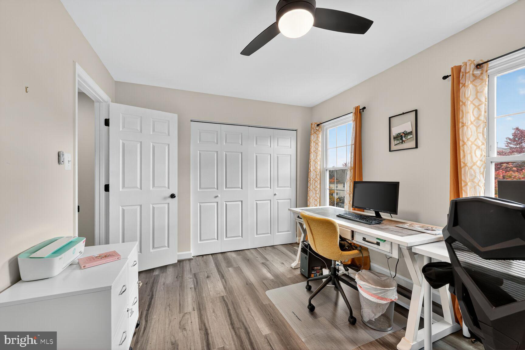 13486 Grouserun Lane Bristow, VA 20136 - Photo 17 of 20 a view of a workspace with furniture and a window
