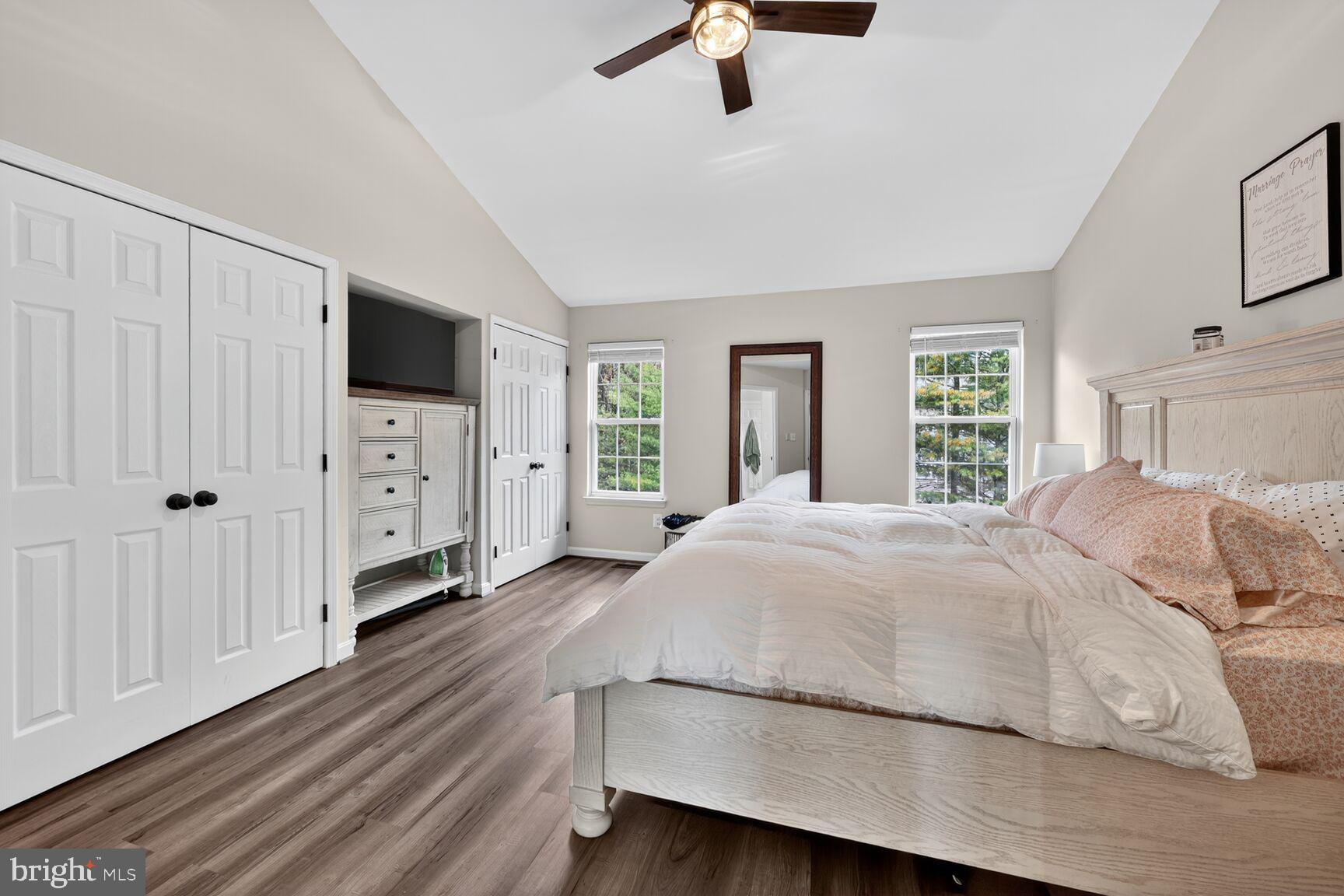 13486 Grouserun Lane Bristow, VA 20136 - Photo 18 of 20 a spacious bedroom with a bed and a flat screen tv