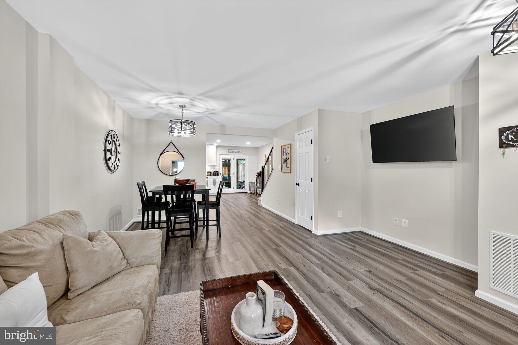 13486 Grouserun Lane Bristow, VA 20136 - Photo 3 of 20 a living room with furniture and a flat screen tv
