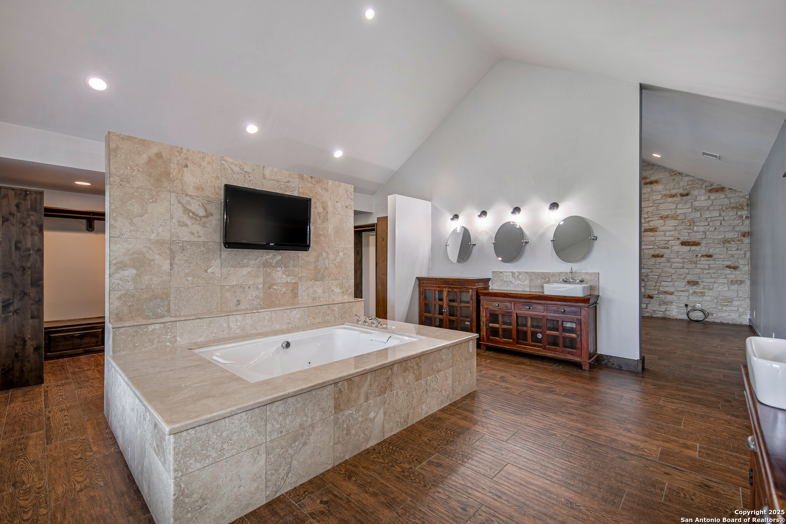 9560 Old Colony Line Road Dale, TX 78616 - Photo 17 of 41 a spacious bedroom with a bed and a flat screen television